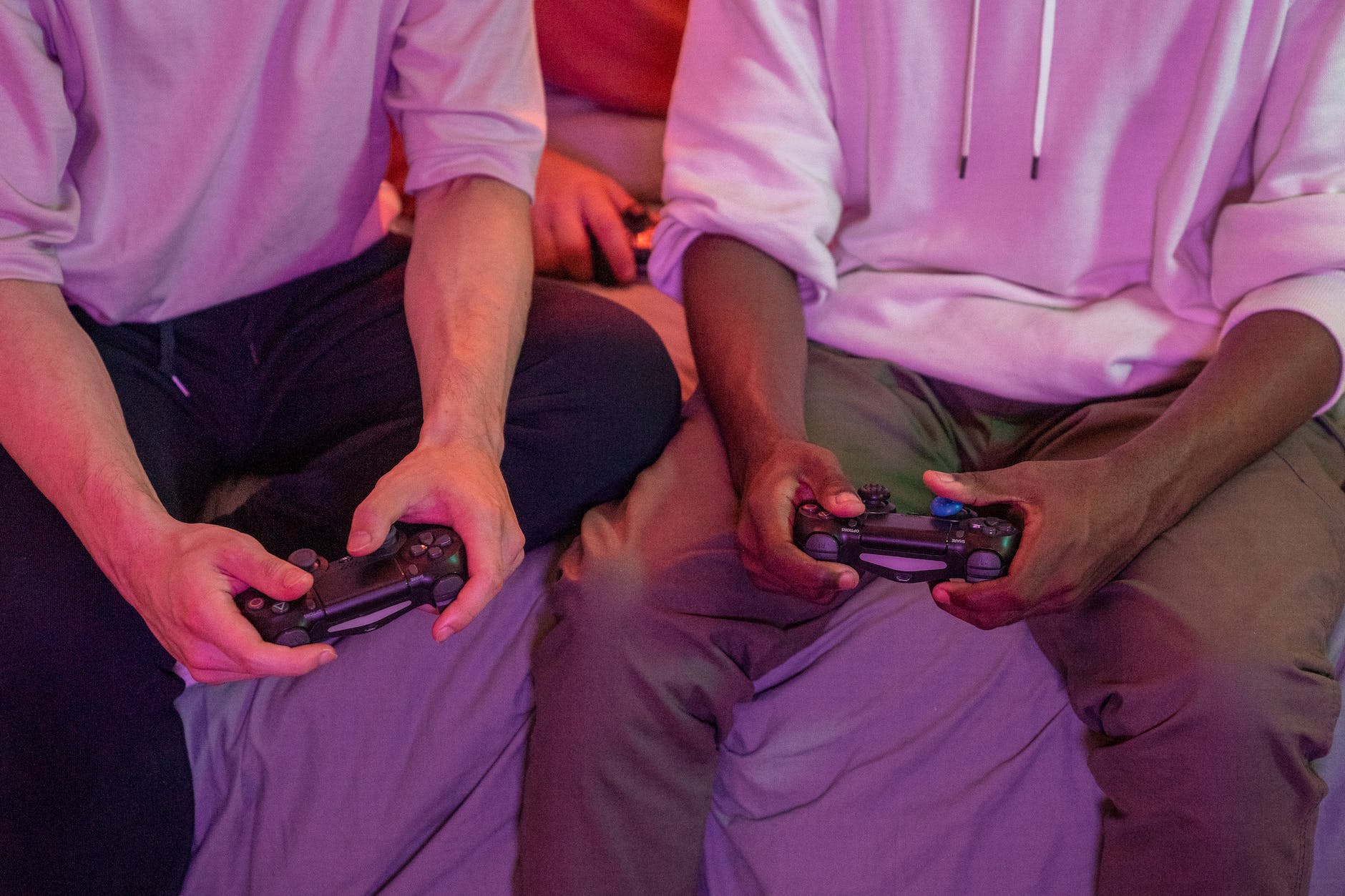 friends sitting together playing video game